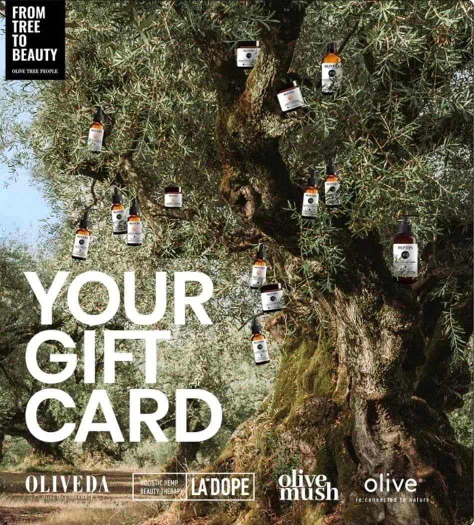 Olive Tree People gift card: Oliveda products hanging in an olive tree with the words Your Gift Card