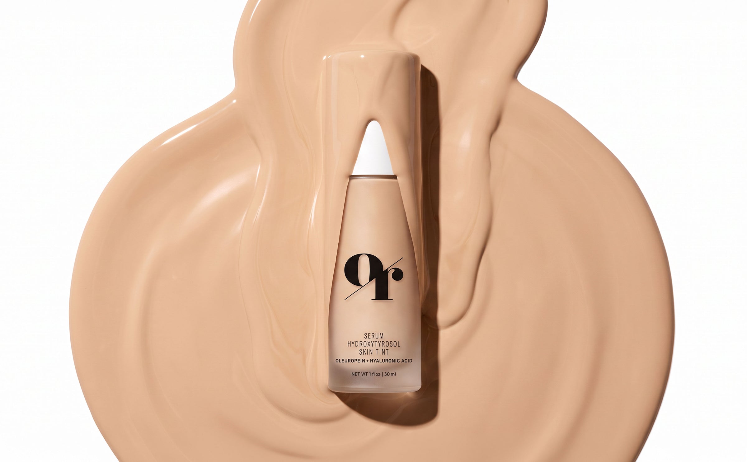 Olive Rose Serum Hydroxytyrosol Skin Tint bottle on a swatch of the skin tint